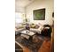 Cozy living room featuring a comfortable sofa and a large decorative painting at 5136 E Evergreen St # 1053, Mesa, AZ 85205