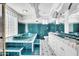 Luxurious bathroom with a teal-colored tub, glass block window, and intricate tile work at 538 S Macdonald --, Mesa, AZ 85210