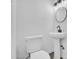 Powder room with pedestal sink and sleek modern fixtures offers elegance at 538 S Macdonald --, Mesa, AZ 85210