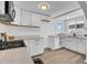Bright kitchen featuring white cabinetry, sleek countertops, and contemporary finishes at 538 S Macdonald --, Mesa, AZ 85210