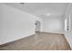 Bright living room with laminate flooring and abundant natural light at 538 S Macdonald --, Mesa, AZ 85210