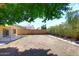 Large backyard with covered patio perfect for entertaining and relaxation at 705 W Country Estates Ave, Gilbert, AZ 85233