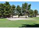 Community basketball court surrounded by lush greenery at 705 W Country Estates Ave, Gilbert, AZ 85233