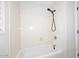 Bright bathroom featuring a sleek, black shower head and clean white tub at 705 W Country Estates Ave, Gilbert, AZ 85233