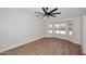 Spacious bedroom with wood floors, a ceiling fan, and a large bay window at 705 W Country Estates Ave, Gilbert, AZ 85233