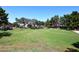 Lush green community space with mature trees offering a serene environment at 705 W Country Estates Ave, Gilbert, AZ 85233