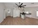 Bright and airy living space featuring vaulted ceilings, wood flooring, and an open concept kitchen at 705 W Country Estates Ave, Gilbert, AZ 85233