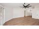 Spacious living space with wood flooring and plenty of natural light, with access to kitchen and entryway at 705 W Country Estates Ave, Gilbert, AZ 85233
