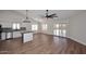 Open floor plan showcasing wood flooring, vaulted ceilings, lots of natural light and a modern kitchen at 705 W Country Estates Ave, Gilbert, AZ 85233