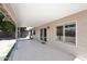 Covered patio with tile flooring and sliding glass door at 705 W Country Estates Ave, Gilbert, AZ 85233