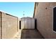 Handy backyard storage shed between homes at 705 W Country Estates Ave, Gilbert, AZ 85233