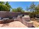 Outdoor patio with a built-in grill and comfortable seating, perfect for entertaining guests at 7403 W Montebello Ave, Glendale, AZ 85303