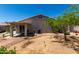 Spacious backyard featuring a covered patio, desert landscaping and potential for creating an outdoor oasis at 7403 W Montebello Ave, Glendale, AZ 85303