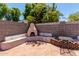 Charming backyard patio features a brick fireplace, brick flooring, and ample space for outdoor gatherings at 7403 W Montebello Ave, Glendale, AZ 85303