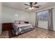 Spacious bedroom featuring a ceiling fan, neutral walls, and tile flooring at 7403 W Montebello Ave, Glendale, AZ 85303