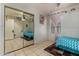 Bright bedroom features a mirrored closet and comfortable bed with a playful design at 7403 W Montebello Ave, Glendale, AZ 85303