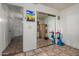 Bedroom with tile flooring, mirrored closet doors, and ample space for recreation or a home office at 7403 W Montebello Ave, Glendale, AZ 85303