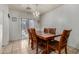Traditional dining room with wood table, seating for six, and sliding glass door at 7403 W Montebello Ave, Glendale, AZ 85303