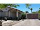 Charming entryway with a covered porch, brick-paved driveway, and gated courtyard at 7403 W Montebello Ave, Glendale, AZ 85303