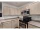 Kitchen with stainless steel oven and microwave, and lots of counter space at 7403 W Montebello Ave, Glendale, AZ 85303