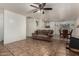 Open-concept living area seamlessly connects to the dining space and showcases stylish tile flooring at 7403 W Montebello Ave, Glendale, AZ 85303