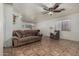 Bright living room boasts tile flooring, neutral colors, and large windows at 7403 W Montebello Ave, Glendale, AZ 85303