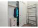 Office sliding door closet with a hanging clothes rod, shelving, and file cabinet at 7726 E Baseline Rd # 125, Mesa, AZ 85209