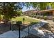 View of the community green, showcasing the well-maintained landscaping and inviting walkways between the homes at 7726 E Baseline Rd # 125, Mesa, AZ 85209