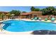 Sparkling community pool with comfortable lounge chairs, offering a refreshing oasis for residents at 7726 E Baseline Rd # 125, Mesa, AZ 85209