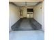 Garage view with water heater, laundry equipment, and cabinets at 7726 E Baseline Rd # 125, Mesa, AZ 85209