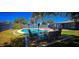 Inviting backyard oasis with a refreshing pool, comfortable seating, and a privacy wall for relaxation at 846 E Ocotillo Rd, Phoenix, AZ 85014