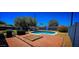 Spacious backyard with a pool, brick patio, barbecue grill, and privacy fence, perfect for outdoor gatherings at 846 E Ocotillo Rd, Phoenix, AZ 85014