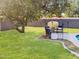 Serene backyard with a lush lawn, mature trees, and a cozy seating area at 846 E Ocotillo Rd, Phoenix, AZ 85014