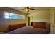 Cozy bedroom with ample natural light, dual dressers for storage, and an attached bathroom at 846 E Ocotillo Rd, Phoenix, AZ 85014