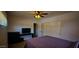 Bedroom features a television, neutral walls and a bed with a lilac coverlet at 846 E Ocotillo Rd, Phoenix, AZ 85014