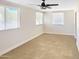 Bright bedroom with neutral walls, tile flooring, and ample natural light through multiple windows at 846 E Ocotillo Rd, Phoenix, AZ 85014