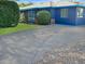 Exterior view of home showcasing the driveway, minimalist landscaping, and blue exterior paint at 846 E Ocotillo Rd, Phoenix, AZ 85014