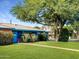 Charming single-story home with a large, mature shade tree enhancing the front yard at 846 E Ocotillo Rd, Phoenix, AZ 85014
