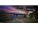 Charming single-story home with brick accents, blue trim, a manicured lawn, and mature landscaping at 846 E Ocotillo Rd, Phoenix, AZ 85014