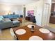 Open-concept living and dining area with stylish decor, tile flooring, and large windows at 846 E Ocotillo Rd, Phoenix, AZ 85014