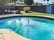 Inviting pool with clear blue water, surrounded by comfortable patio furniture for relaxing outdoor enjoyment at 846 E Ocotillo Rd, Phoenix, AZ 85014