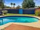 Beautiful pool area with refreshing blue water and manicured landscaping creates a serene backyard oasis at 846 E Ocotillo Rd, Phoenix, AZ 85014