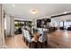 Open-concept dining area with a long table, seating for eight, and seamless transition to the outdoors at 8708 E Rancho Vista Dr, Scottsdale, AZ 85251