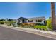 Inviting single-Gathering home featuring manicured landscaping and charming front porch at 8708 E Rancho Vista Dr, Scottsdale, AZ 85251