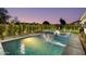 Inviting pool and spa area with lush landscaping, in-pool loungers, and tranquil ambiance at 8708 E Rancho Vista Dr, Scottsdale, AZ 85251