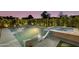 Luxurious pool with built-in spa, underwater lounge chairs, and stylish concrete patio at 8708 E Rancho Vista Dr, Scottsdale, AZ 85251