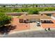 An aerial view of a single-Gathering home featuring a three-car garage and neutral desert landscaping at 10018 N 97Th Dr # A, Peoria, AZ 85345