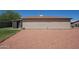 A fully-enclosed backyard featuring neutral tan stucco, a neutral roof, and easy-to-care-for landscaping at 10018 N 97Th Dr # A, Peoria, AZ 85345