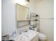 Bathroom with a marble-look sink and white toilet, featuring shelving above at 10018 N 97Th Dr # A, Peoria, AZ 85345