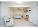 Carpeted bedroom with ceiling fan, mounted television, and a floral armchair at 10018 N 97Th Dr # A, Peoria, AZ 85345